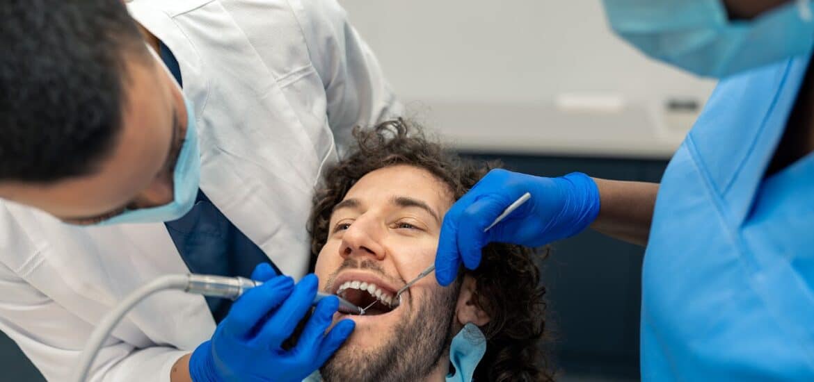 Young Man Having Dental Drill Procedure At Dentist's Office | Smile Virtual