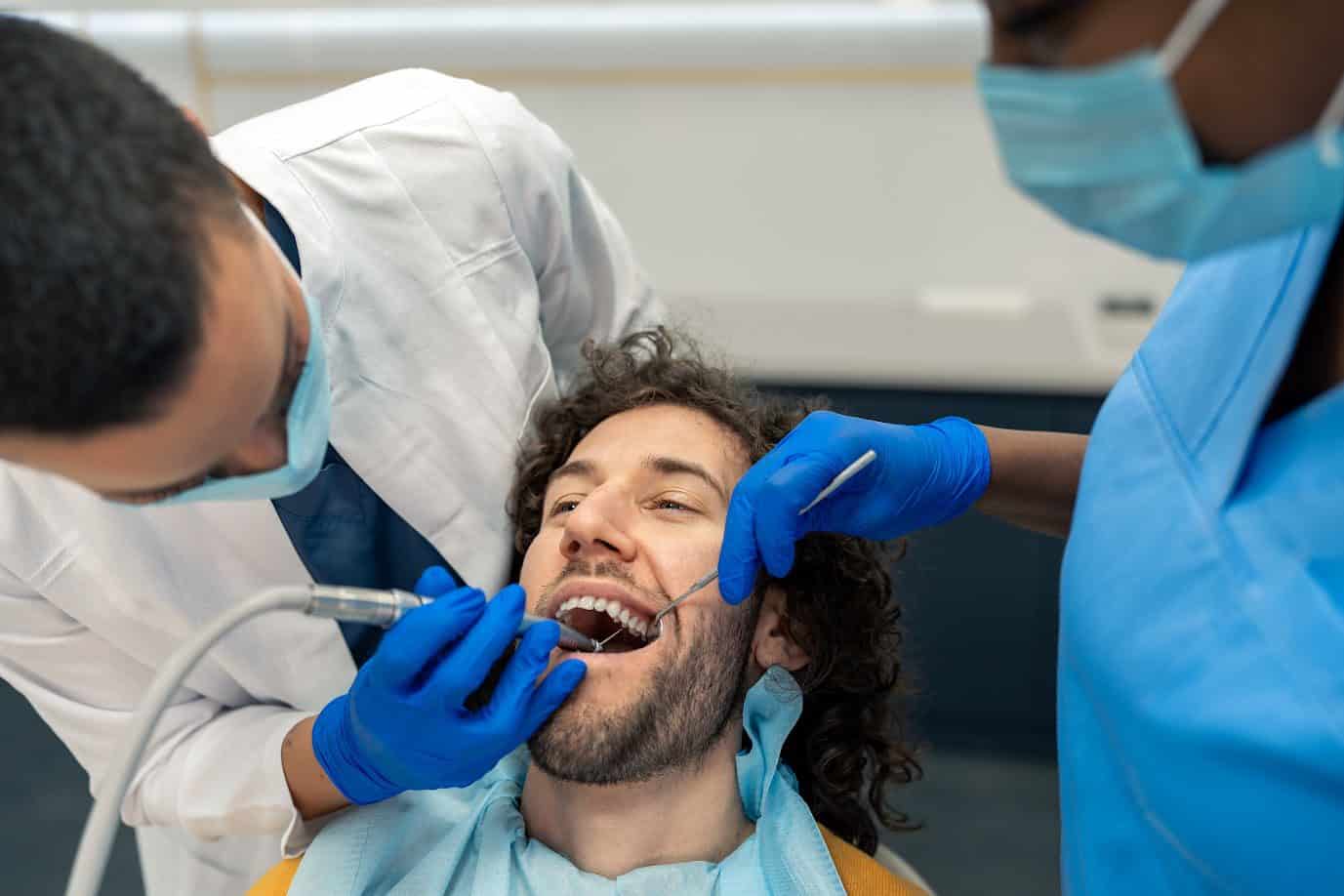 Young Man Having Dental Drill Procedure At Dentist's Office | Smile Virtual