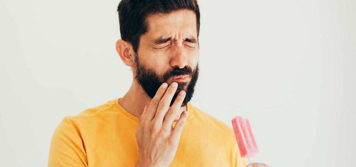 Men Holding Strawberry Bar And Pain Sensitivity Started On His Teeth | Smile Virtual