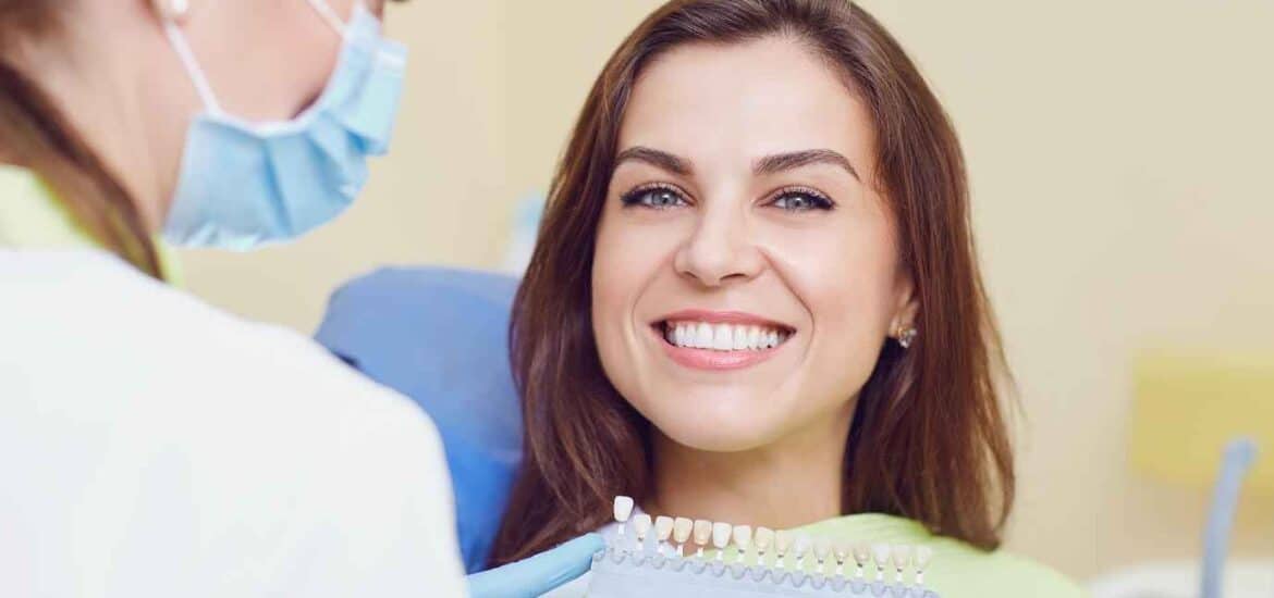 Dentist Holding Veneers Infront of Young Girl | Smile Virtual